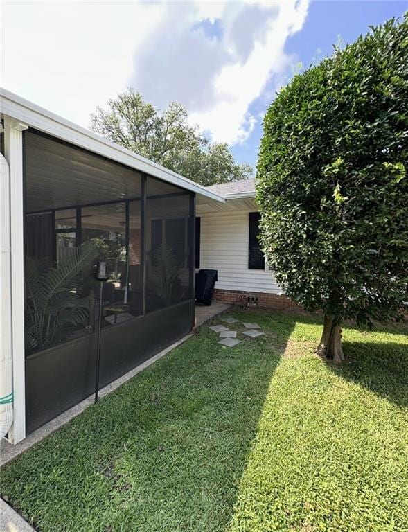 2911 Thornhill Dr, Mobile, AL 36606 - view of grassy yard featuring a sunroom