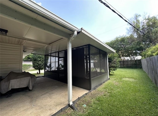 2911 Thornhill Dr, Mobile, AL 36606 - view of home's exterior with a sunroom and a fenced backyard