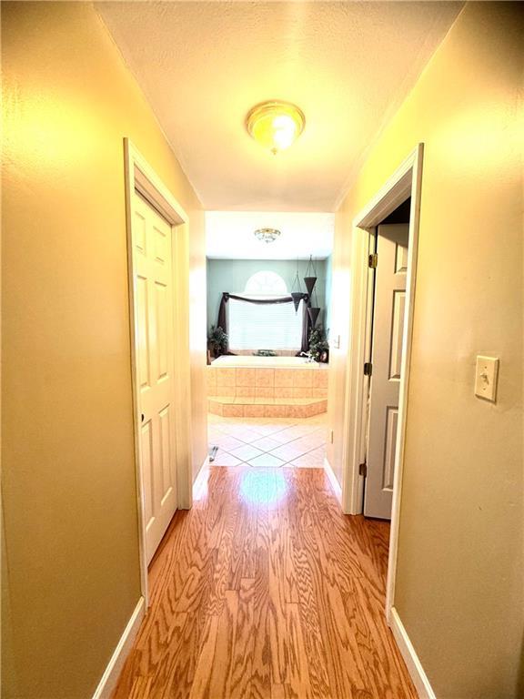 14522 St Stephens Ave, Chatom, AL 36518 - hall featuring baseboards and wood finished floors