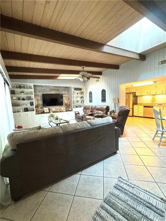 14522 St Stephens Ave, Chatom, AL 36518 - living room with a ceiling fan, visible vents, beam ceiling, and light tile patterned floors