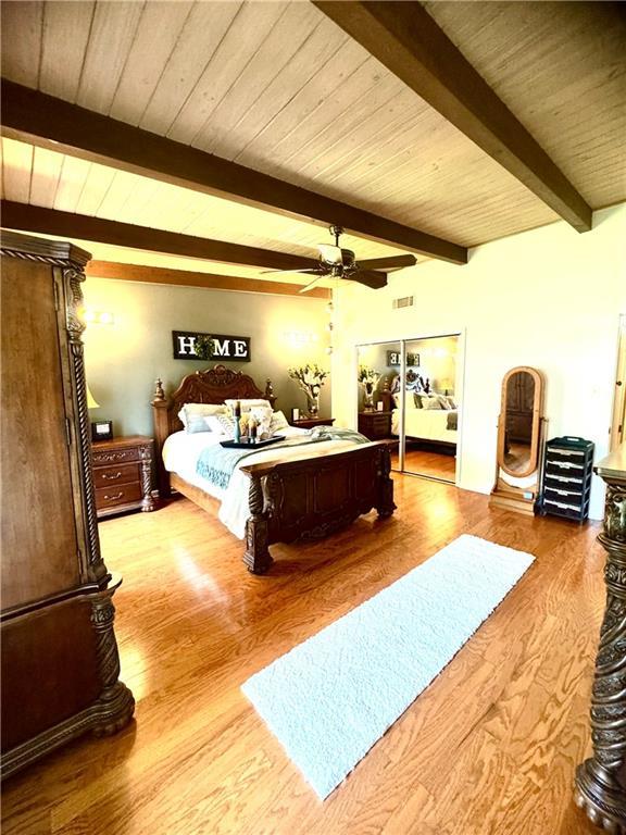 14522 St Stephens Ave, Chatom, AL 36518 - bedroom with wood finished floors, visible vents, a ceiling fan, beamed ceiling, and wood ceiling