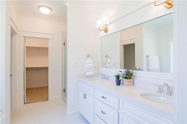 305 Hannah Chase Way, Satsuma, AL 36572 - bathroom featuring a shower stall, a walk in closet, double vanity, tile patterned floors, and baseboards