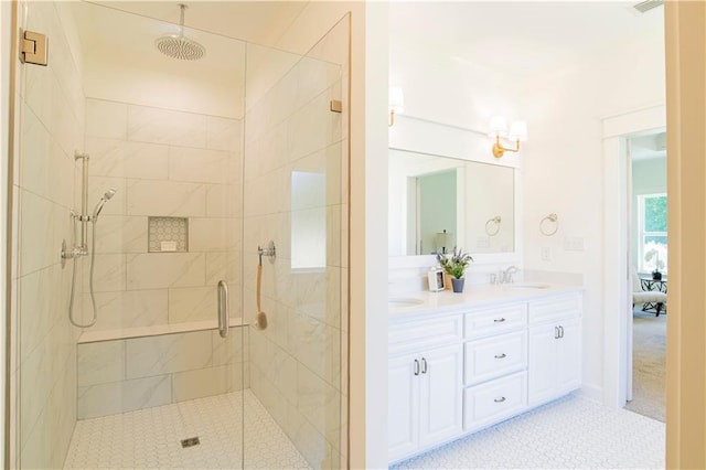 305 Hannah Chase Way, Satsuma, AL 36572 - full bathroom featuring a shower stall, double vanity, and tile patterned flooring