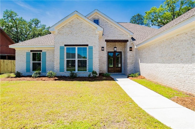305 Hannah Chase Way, Satsuma, AL 36572 - view of front of home with french doors, brick siding, and a shingled roof
