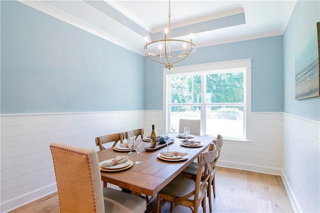 305 Hannah Chase Way, Satsuma, AL 36572 - dining area featuring wainscoting, a chandelier, light wood finished floors, crown molding, and wood walls