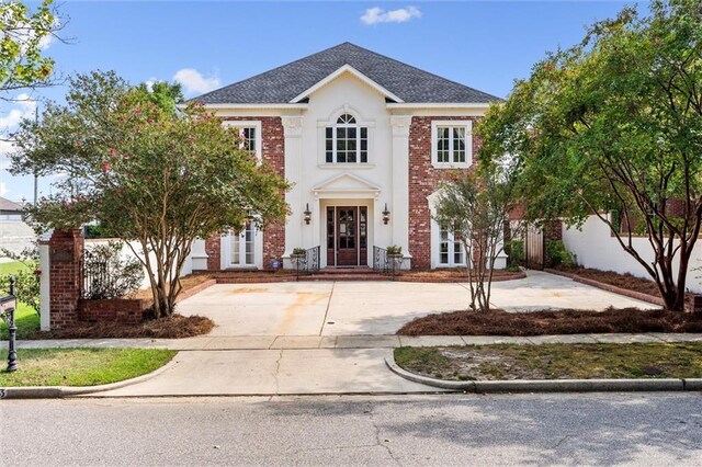 colonial home featuring french doors