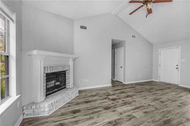 13163 Buckthorn Ct, Mobile, AL 36608 - unfurnished living room with ceiling fan, plenty of natural light, beamed ceiling, high vaulted ceiling, and wood finished floors