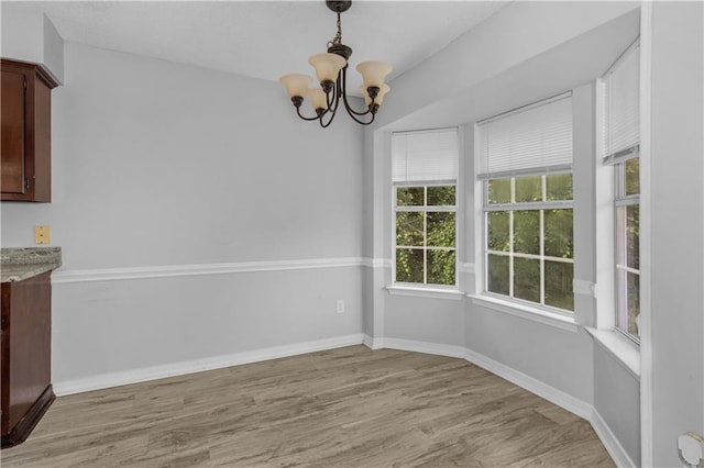 13163 Buckthorn Ct, Mobile, AL 36608 - unfurnished dining area with a chandelier and light wood finished floors