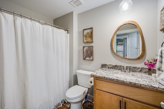 7420 Pake Rd, Saraland, AL 36571 - full bath featuring toilet, vanity, curtained shower, and visible vents