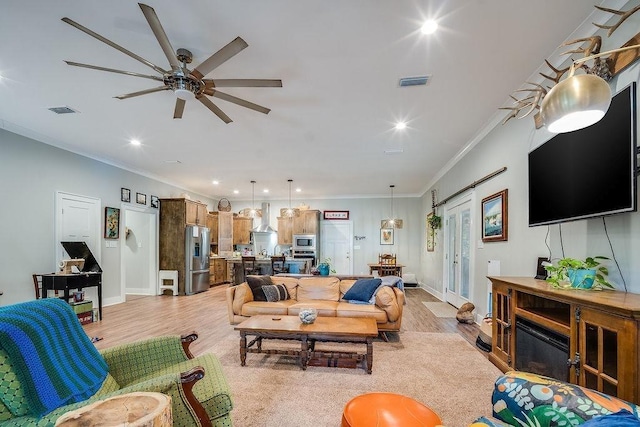 7420 Pake Rd, Saraland, AL 36571 - living room featuring ornamental molding, visible vents, and light wood-style floors