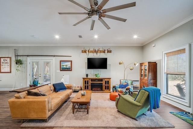 7420 Pake Rd, Saraland, AL 36571 - living room with ceiling fan, wood finished floors, crown molding, and plenty of natural light