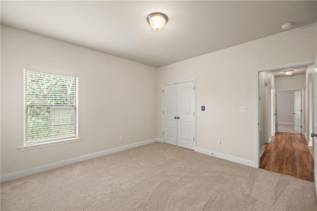 unfurnished room featuring carpet floors