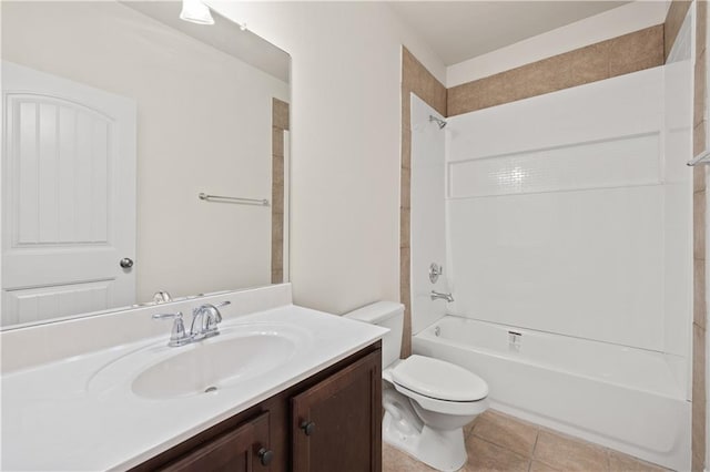 full bathroom with tile floors, shower / washtub combination, toilet, and vanity