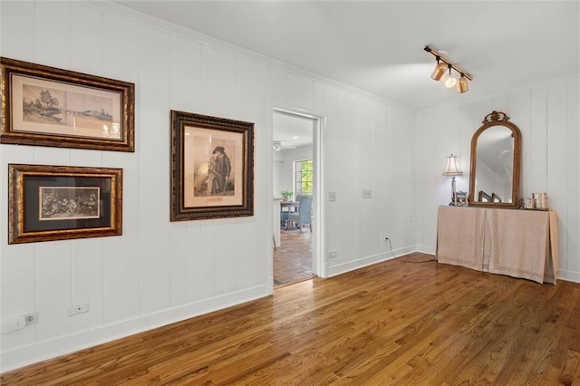 65 Byrnes Blvd, Mobile, AL 36608 - spare room with wood finished floors, baseboards, ornamental molding, and rail lighting