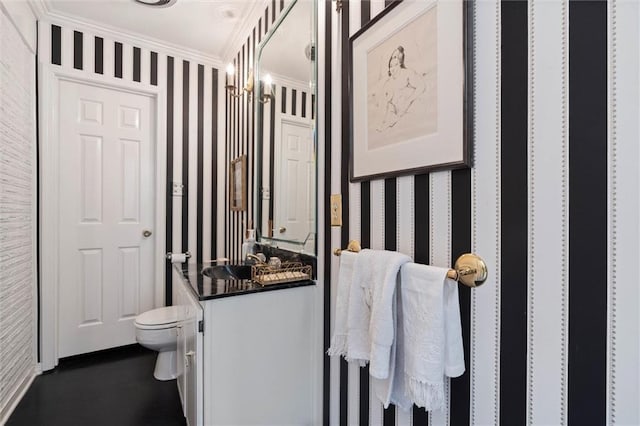 65 Byrnes Blvd, Mobile, AL 36608 - bathroom featuring wallpapered walls, toilet, crown molding, and a sink