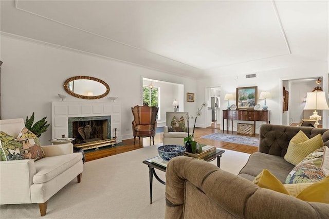 65 Byrnes Blvd, Mobile, AL 36608 - living room with a fireplace, wood finished floors, and a raised ceiling