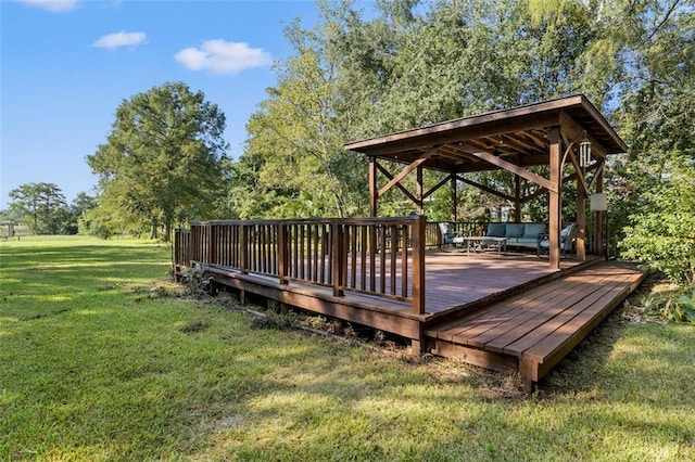 deck featuring a gazebo and a yard