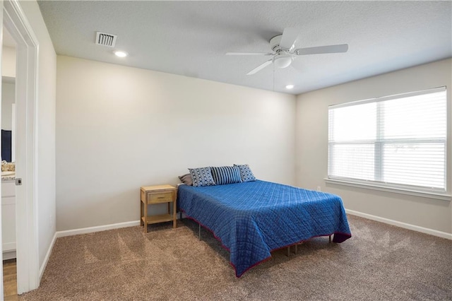 bedroom featuring carpet, visible vents, and baseboards