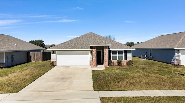 view of front of property featuring an attached garage, central AC, brick siding, concrete driveway, and a front lawn