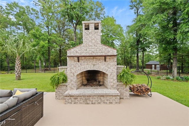 view of patio with fence and an outdoor living space with a fireplace
