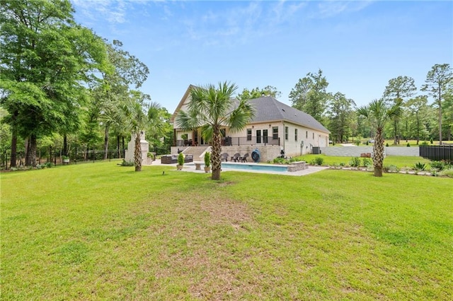view of yard featuring fence, a fenced in pool, and a patio