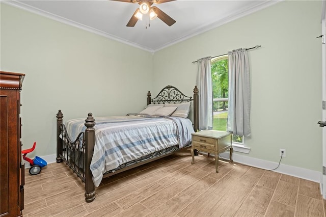 bedroom featuring a ceiling fan, baseboards, wood finish floors, and ornamental molding