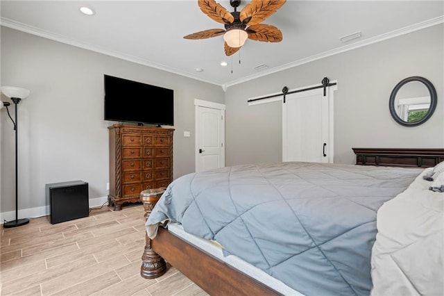 bedroom with recessed lighting, wood finish floors, a barn door, and ornamental molding