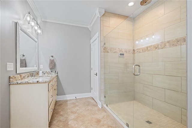 full bath with crown molding, baseboards, vanity, and a shower stall
