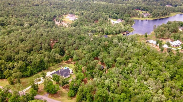 bird's eye view featuring a view of trees and a water view