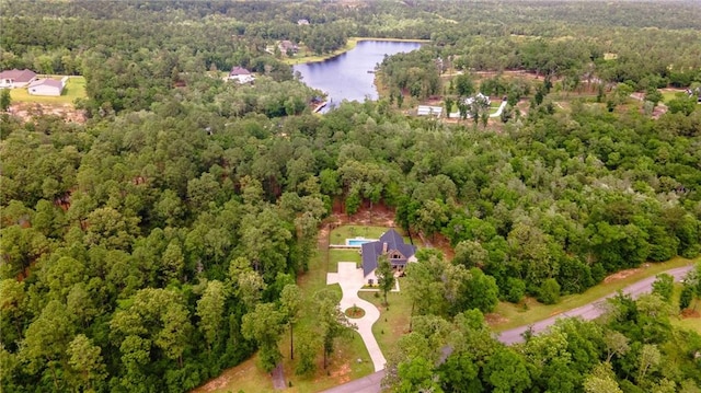 drone / aerial view with a water view and a wooded view