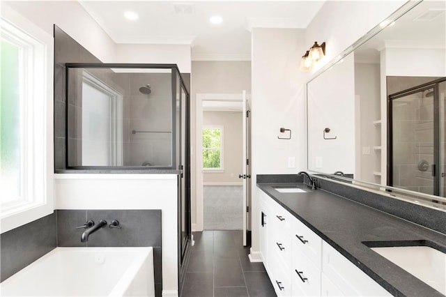 bathroom with a sink, tile patterned floors, a shower stall, and a garden tub