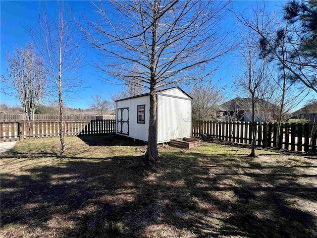 view of shed with a fenced backyard