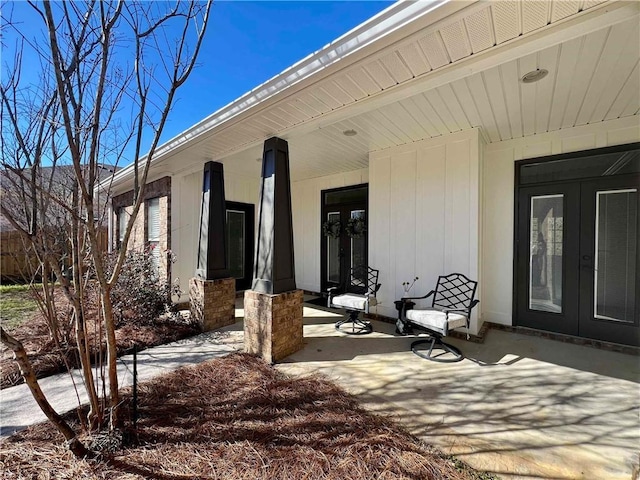 view of patio / terrace featuring a porch and french doors