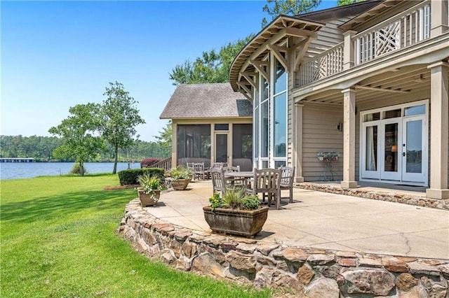 34460 Steelwood Ridge Rd, Loxley, AL 36551 - patio / terrace featuring a patio area, a yard, a sunroom, a water view, and french doors