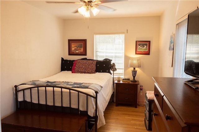 bedroom with ceiling fan and light wood-type flooring