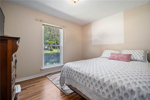 bedroom featuring dark hardwood / wood-style floors