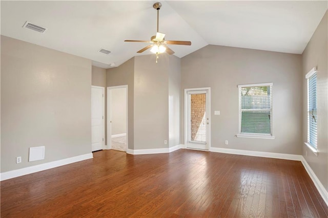 unfurnished room with baseboards, dark wood finished floors, visible vents, and a healthy amount of sunlight