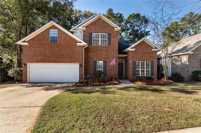 view of property featuring a garage and a front lawn