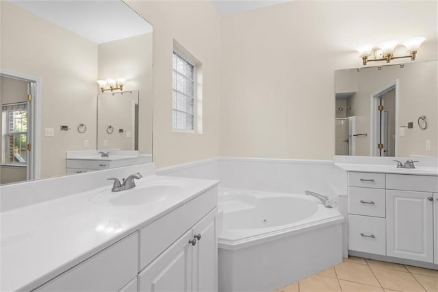 bathroom with tile patterned flooring, shower with separate bathtub, and vanity