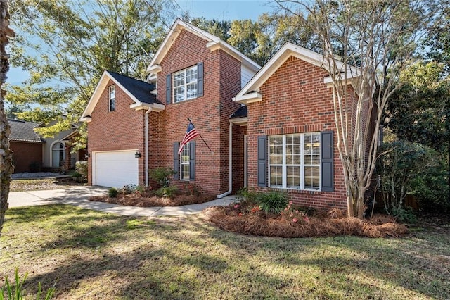 front of property featuring a garage and a front lawn