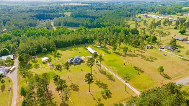 bird's eye view featuring a wooded view