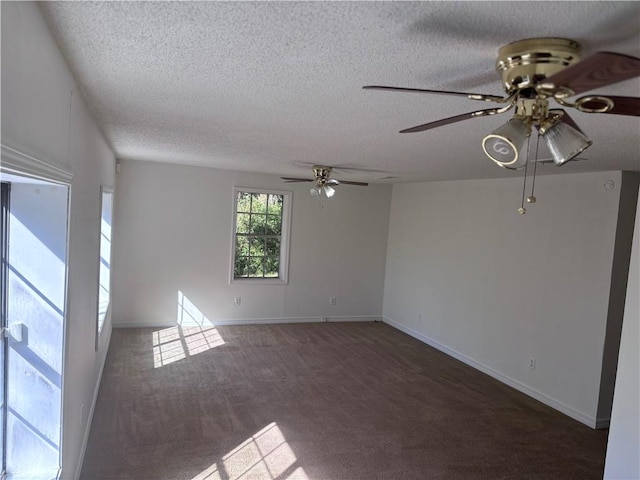 carpeted spare room with ceiling fan and a textured ceiling