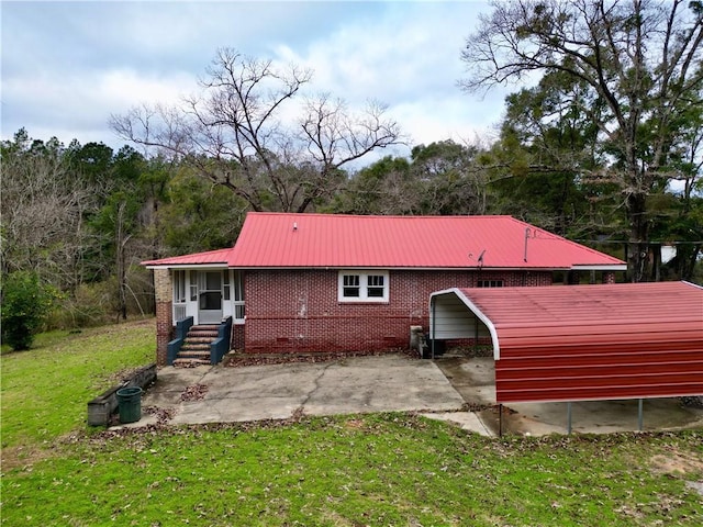 6830 Freedom Ln, Eight Mile, AL 36613 - back of property featuring a yard, metal roof, a detached carport, brick siding, and a wooded view
