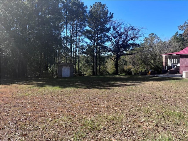 6830 Freedom Ln, Eight Mile, AL 36613 - view of green lawn featuring a patio