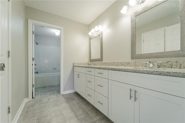 bathroom with vanity, bathtub / shower combination, and tile patterned flooring