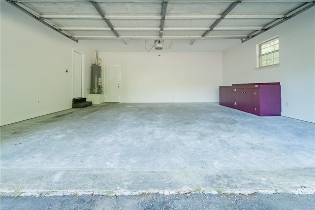 garage featuring a garage door opener and water heater