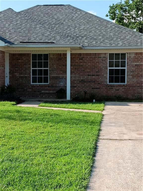 exterior space featuring a lawn