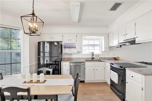 13310 August Dr, Mobile, AL 36695 - kitchen with black appliances, a sink, under cabinet range hood, a chandelier, and white cabinetry