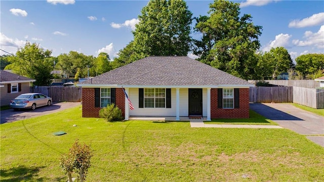 13310 August Dr, Mobile, AL 36695 - bungalow featuring asphalt driveway, covered porch, roof with shingles, and brick siding