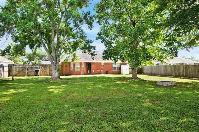 13310 August Dr, Mobile, AL 36695 - view of yard featuring an outdoor fire pit